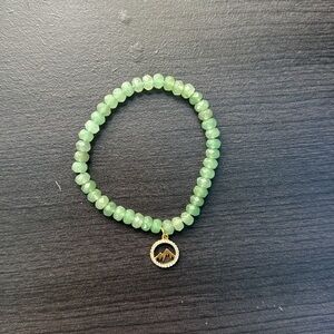 Like New Green Gemstones Bracelet with Mountain Charm Surrounded by Silver Gems
